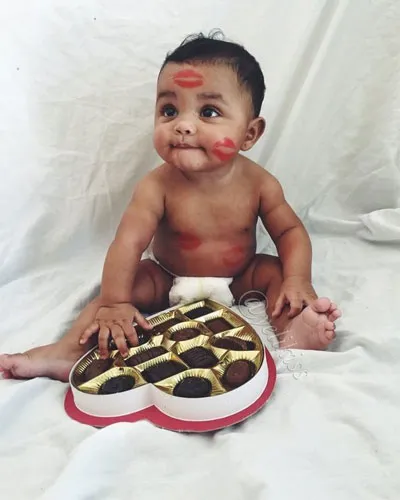 Baby with a box of chocolate